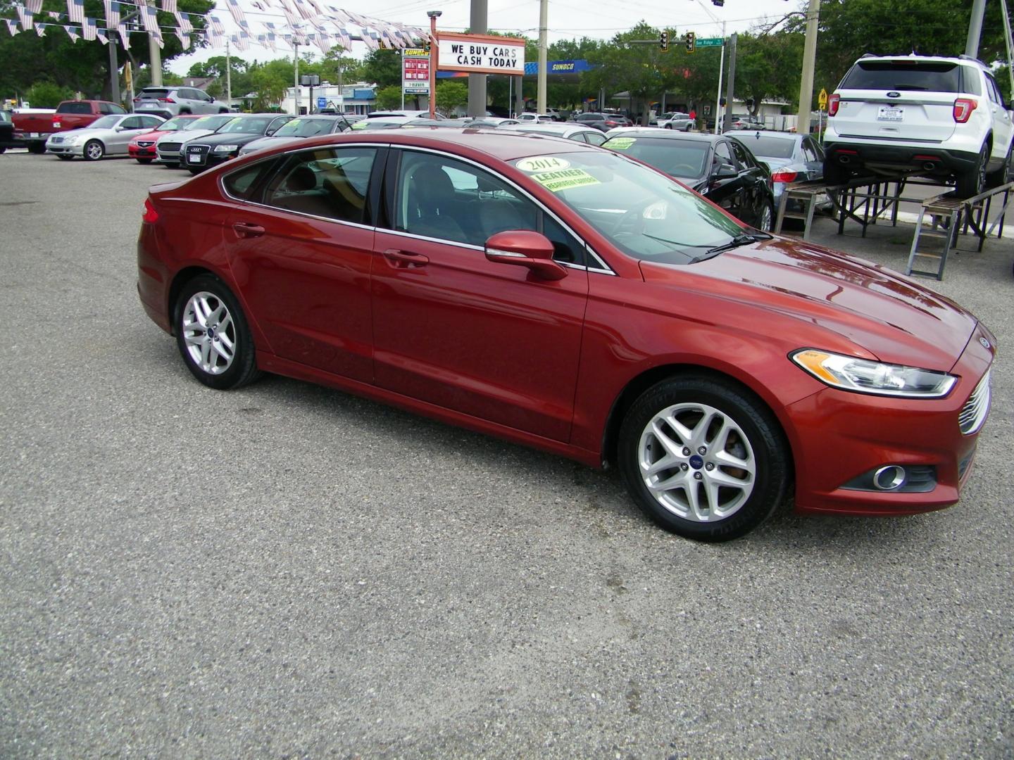 2014 Orange /Black Ford Fusion SE (3FA6P0HD7ER) with an 1.5L L4 DOHC 16V engine, Automatic transmission, located at 4000 Bee Ridge Road, Sarasota, FL, 34233, (941) 926-0300, 27.298664, -82.489151 - Photo#7